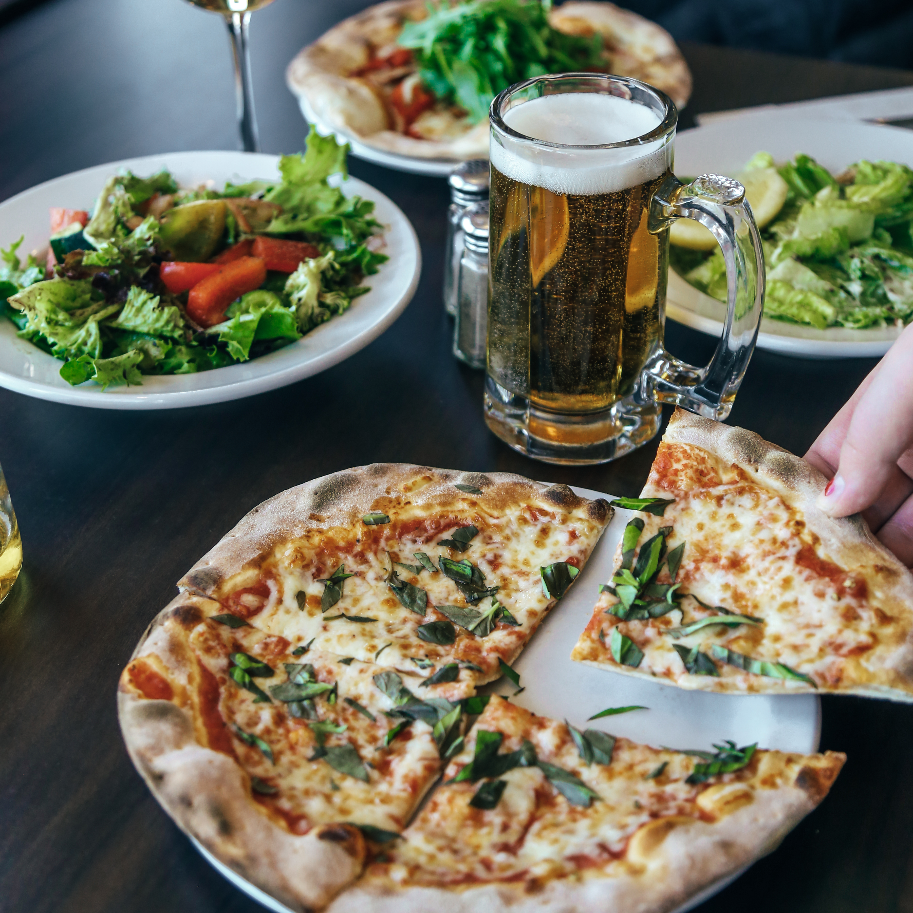Pizza, salad and beer at La Piazza