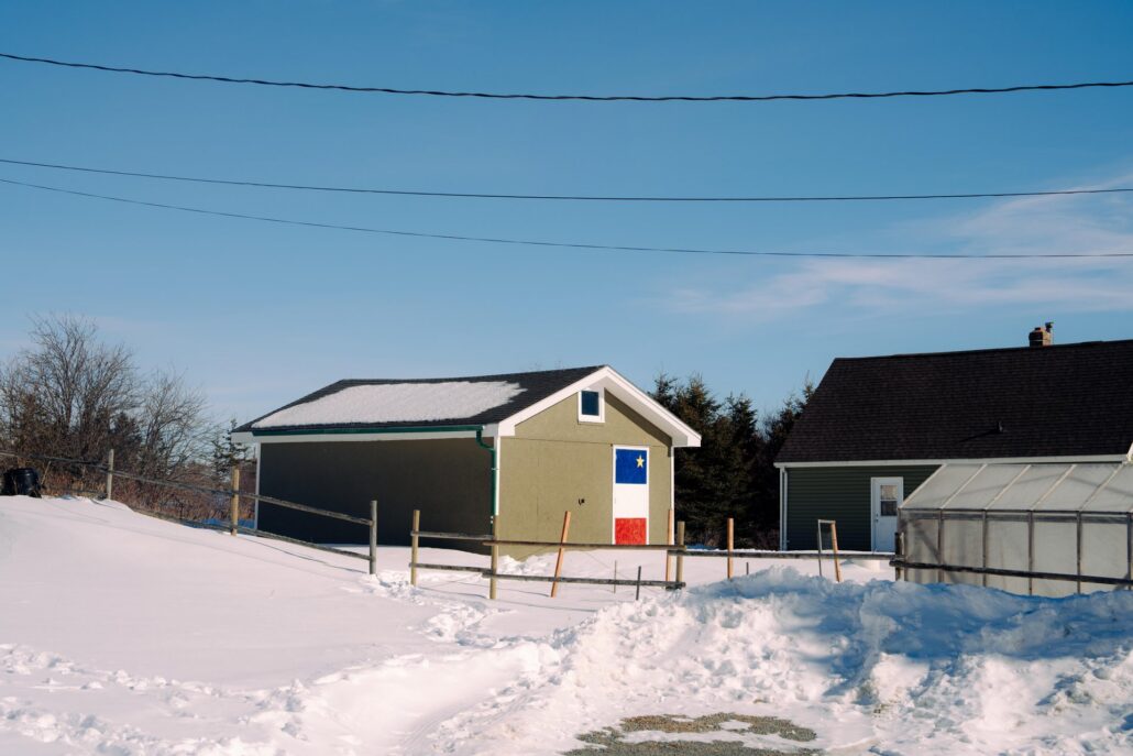Building with Acadian flag at L’Acadie de Chezzetcook.