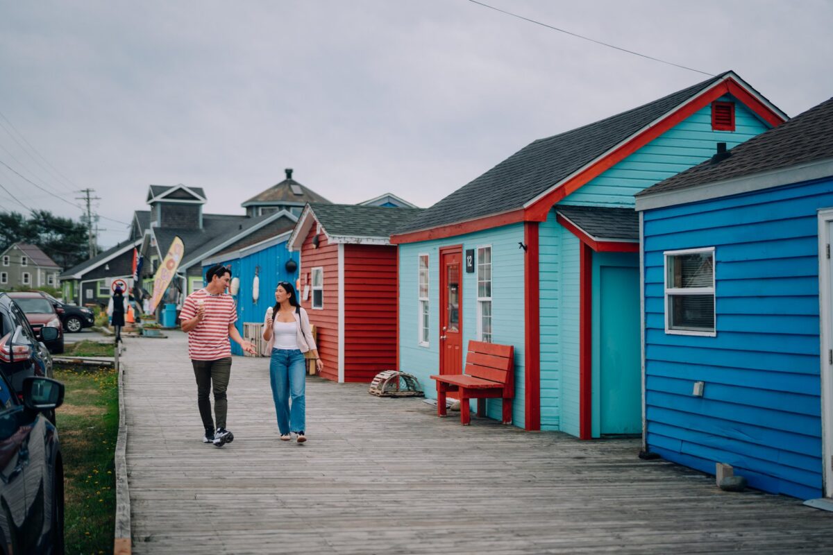 Two people walking with ice cream at Fisherman's Cove