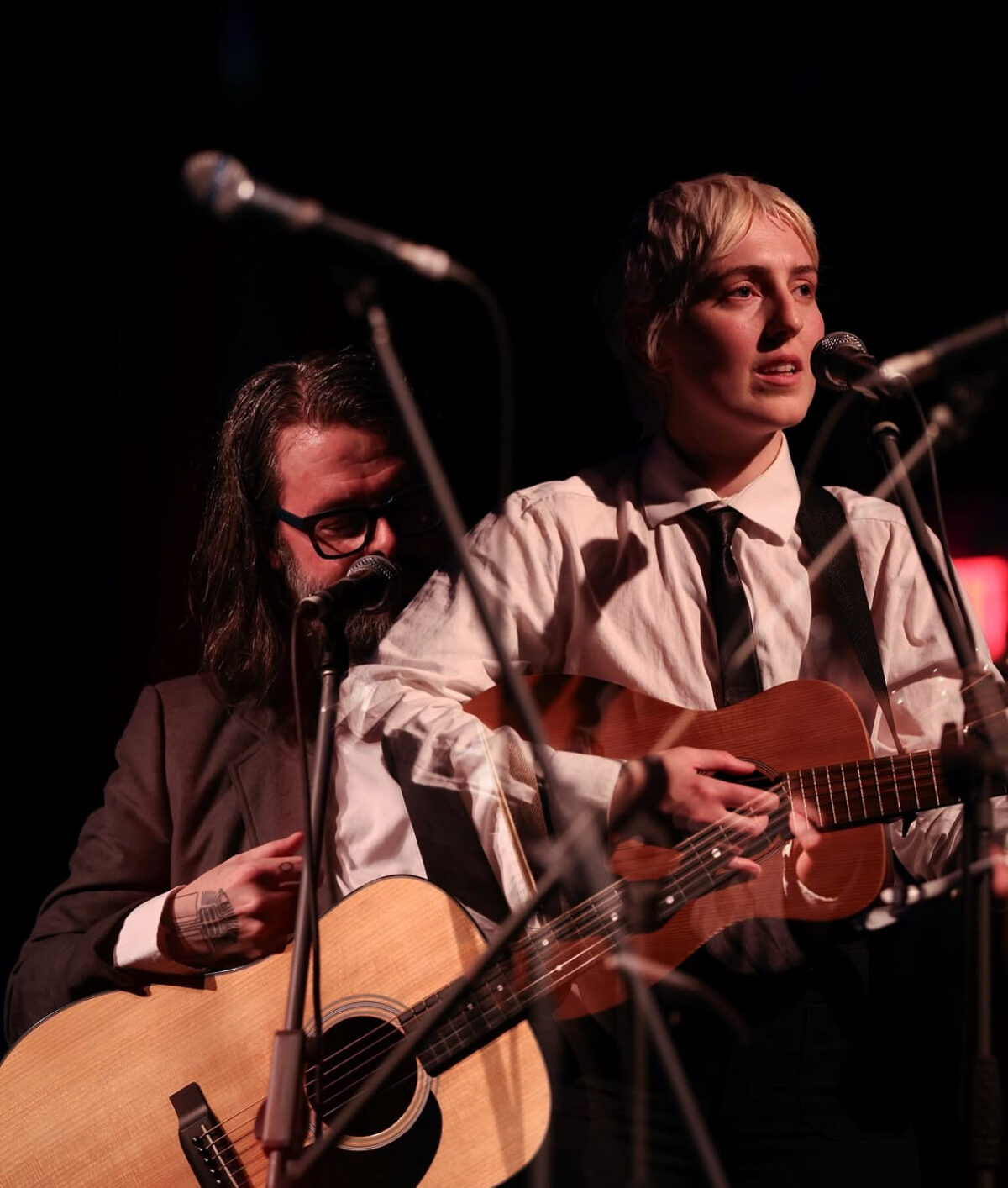 Halifax indie folk duo Pillow Fite performing live on stage with acoustic guitars.