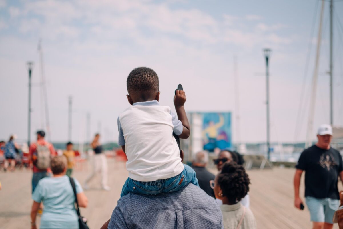 A family walking along the Halifax Waterfront.