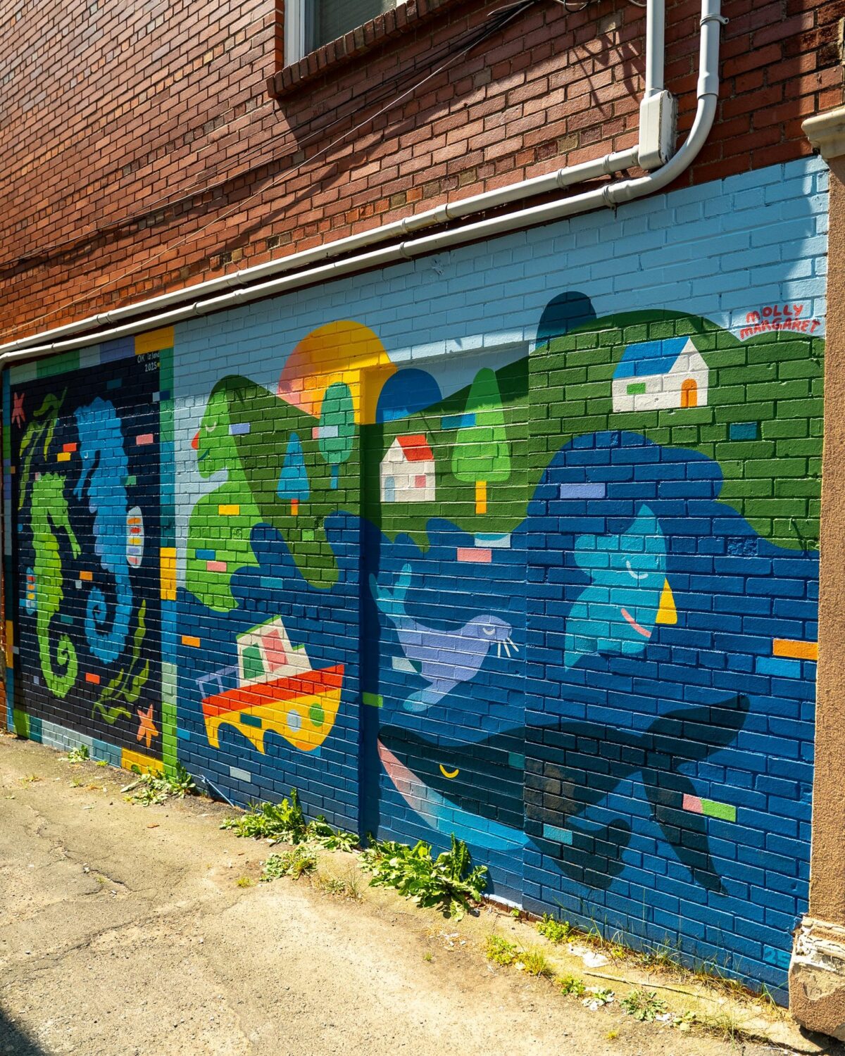 Mural by Molly Margaret and OK Island on Quinpool Street.