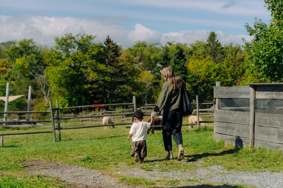Parent and child exploring the Cole Harbour Heritage Farm Museum.